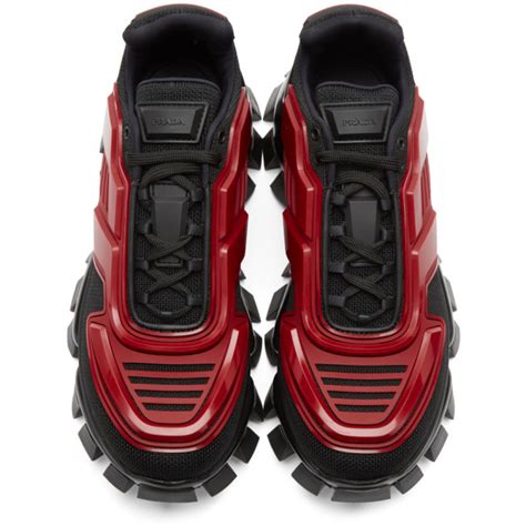 red and black prada sneakers.